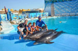 photos outside the Swimming Pool with the Dolphins Family, Kids