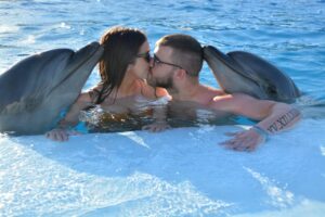 Photo Session with Dolphins in Pool for Family with Kids All Ages and Individuals Couples